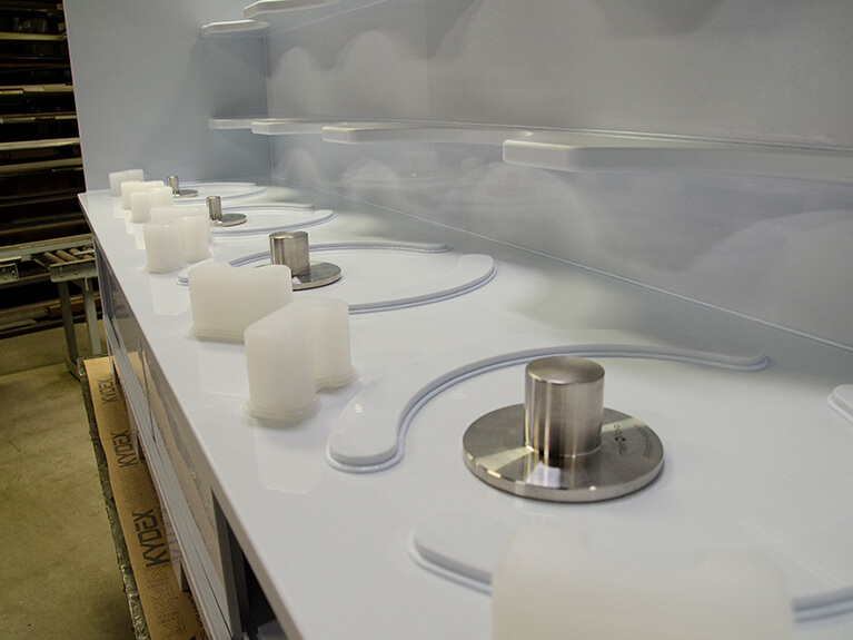 Single-use mixing cabinet close up featuring top-mounted magnetic mixer drives